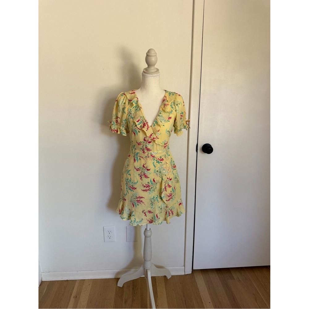 LIKELY yellow floral mini dress with ruffle details and tie back